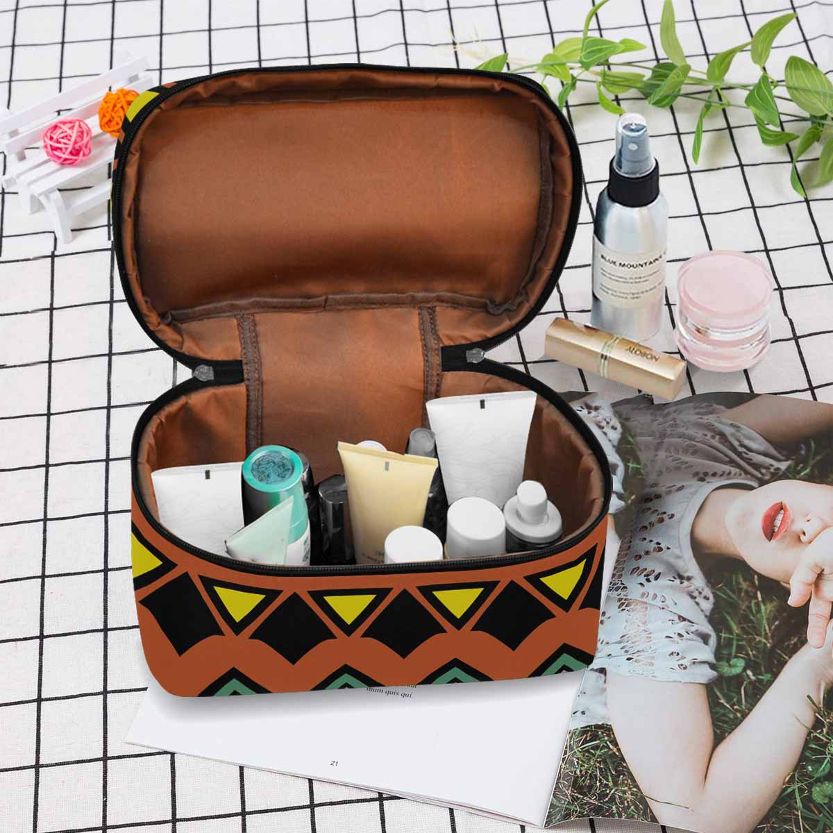 A stylish black and brown waterproof cosmetic bag with a zipper closure, perfect for organizing beauty essentials while traveling.