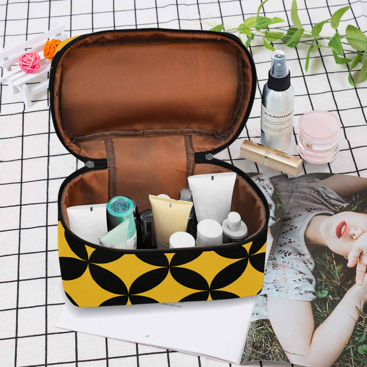 Stylish black and brown waterproof cosmetic bag with zipper closure, ideal for travel and organization.