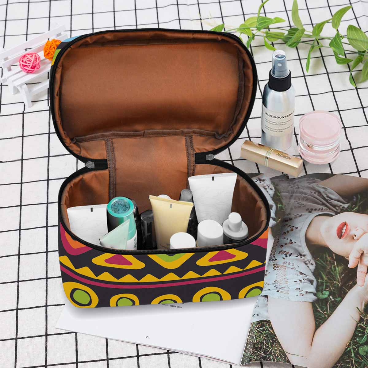 A stylish waterproof cosmetic bag in black and brown, featuring a zipper closure, ideal for travel and organization of beauty products.