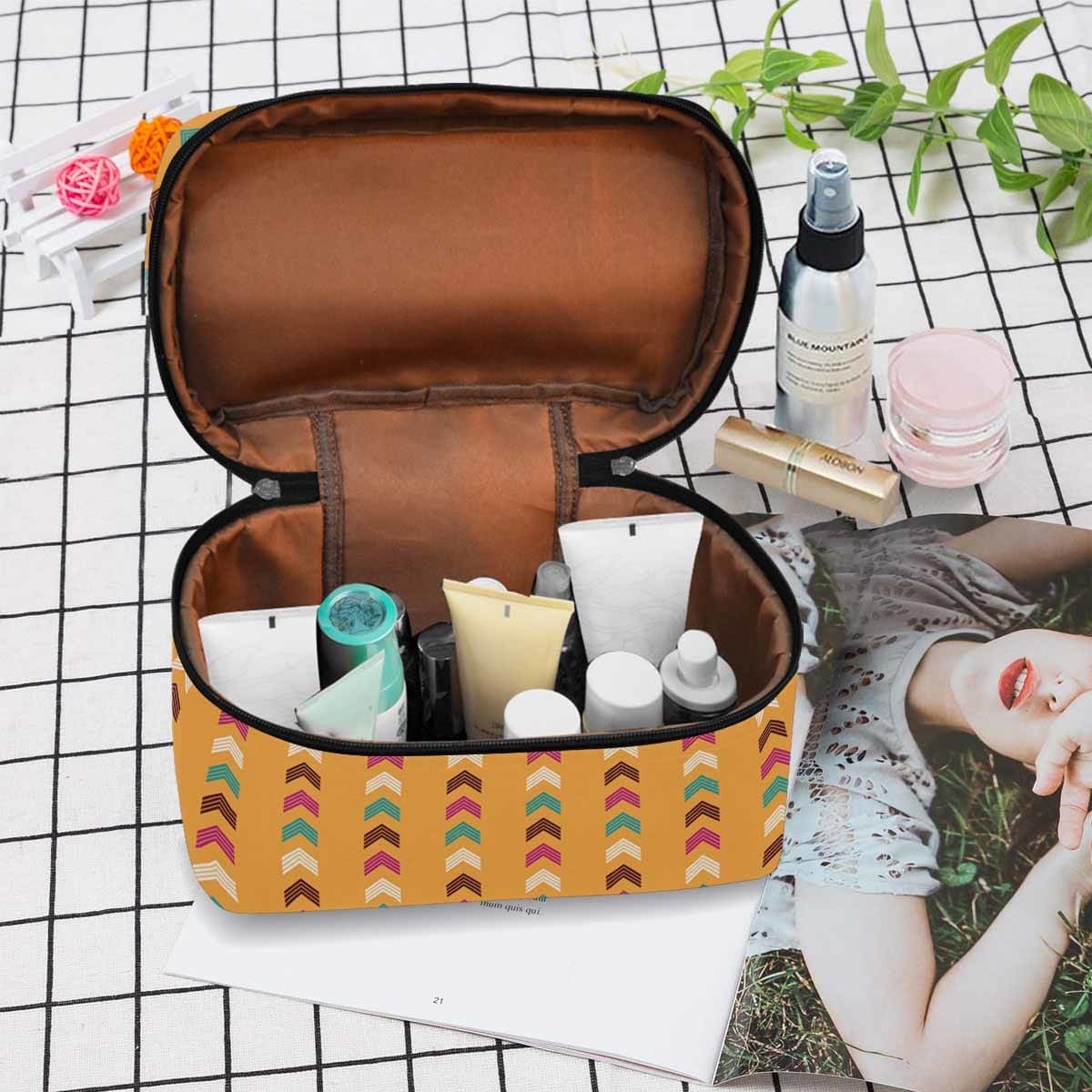 A stylish waterproof cosmetic bag in black and brown, featuring a zipper closure, perfect for travel and organization.