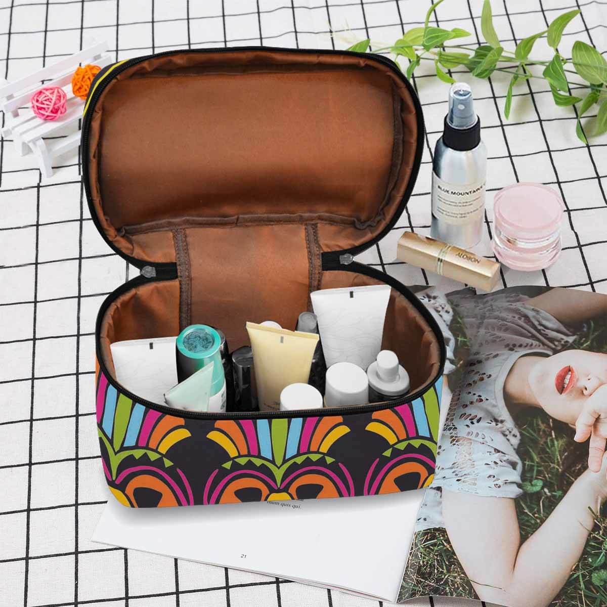 A stylish waterproof cosmetic bag in black and brown, featuring a secure zipper closure, ideal for travel and organization of beauty products.