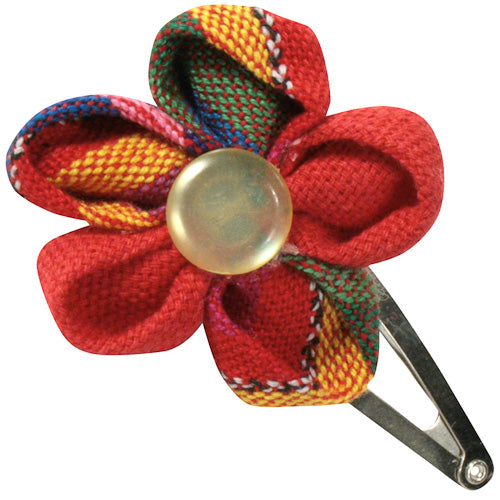 Colorful handmade Cotton Flower Hair Clip featuring vibrant Guatemalan fabrics, perfect for little girls.