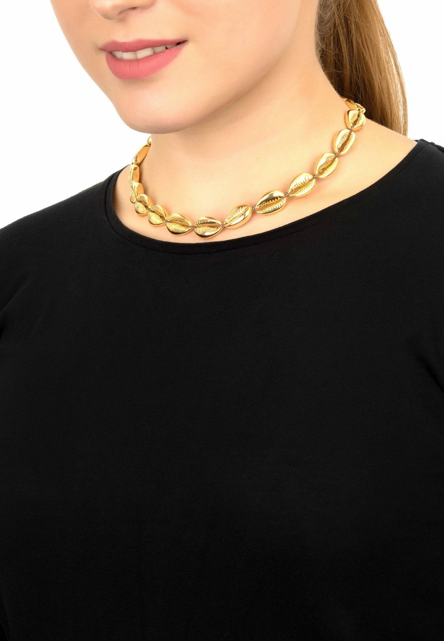 A beautiful Cowrie Shell Choker Strand Necklace in gold, featuring a row of golden cowrie shells on an adjustable strand.