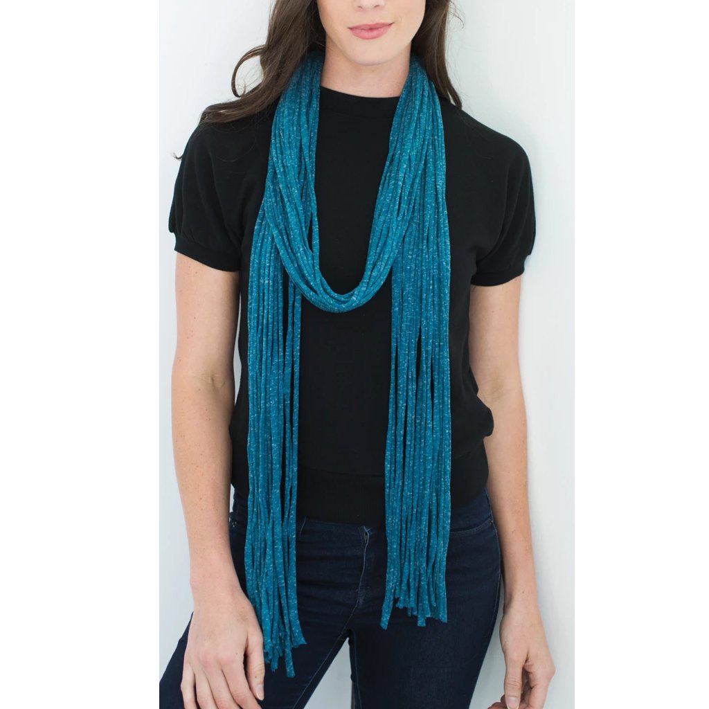 Cozy Teal Fiona wrap made from lightweight recycled fabrics, elegantly draped on a mannequin.