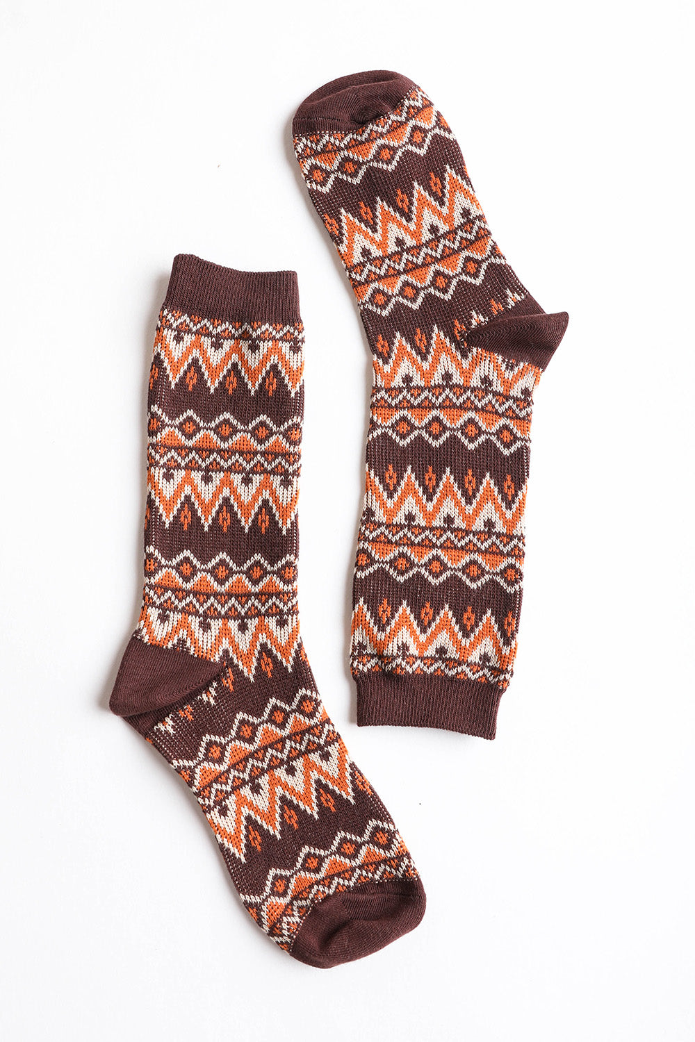 A pair of cozy tribal pattern socks featuring a warm and fuzzy texture, perfect for winter wear.