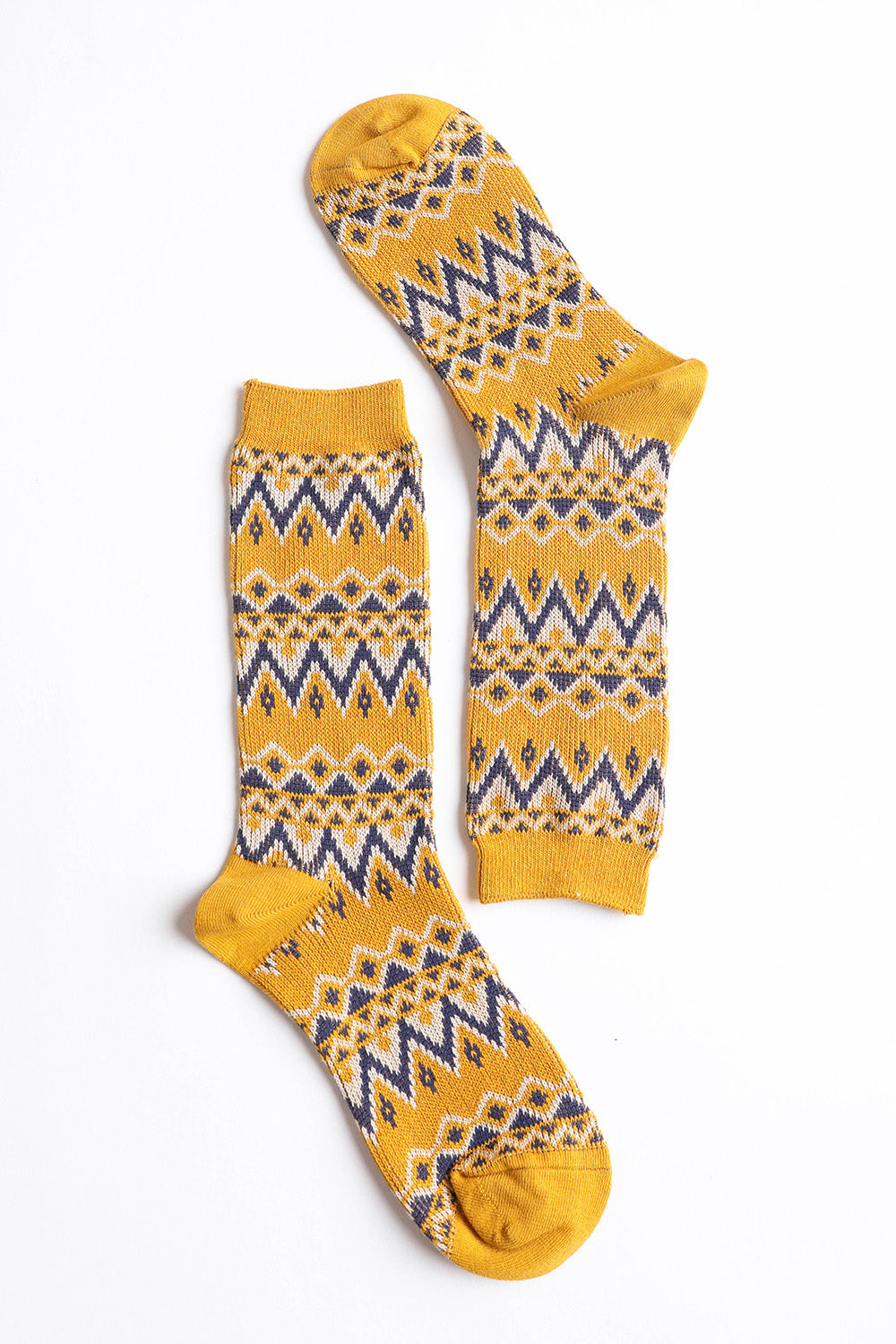 A pair of cozy tribal pattern socks featuring a warm and fuzzy texture, perfect for winter wear.