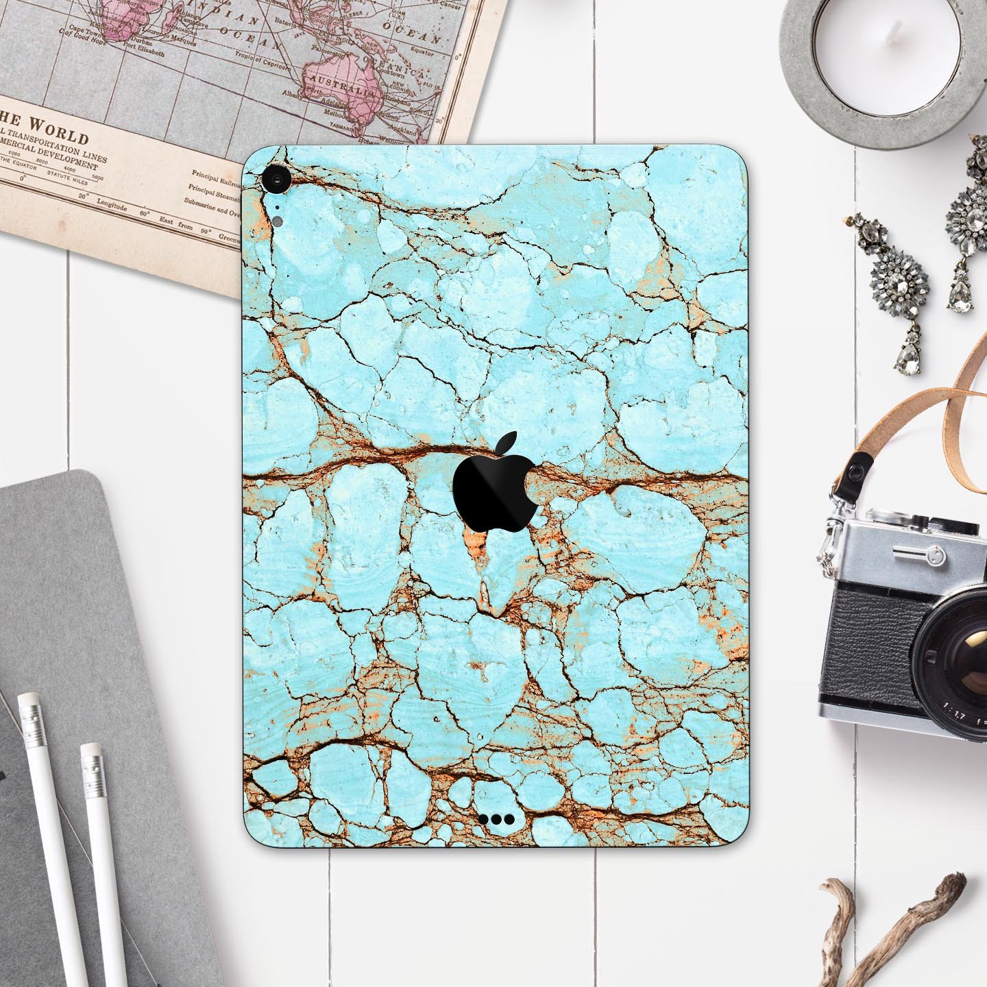 Cracked Teal Stone skin decal for Apple iPad Pro, showcasing its vibrant design and premium finish.