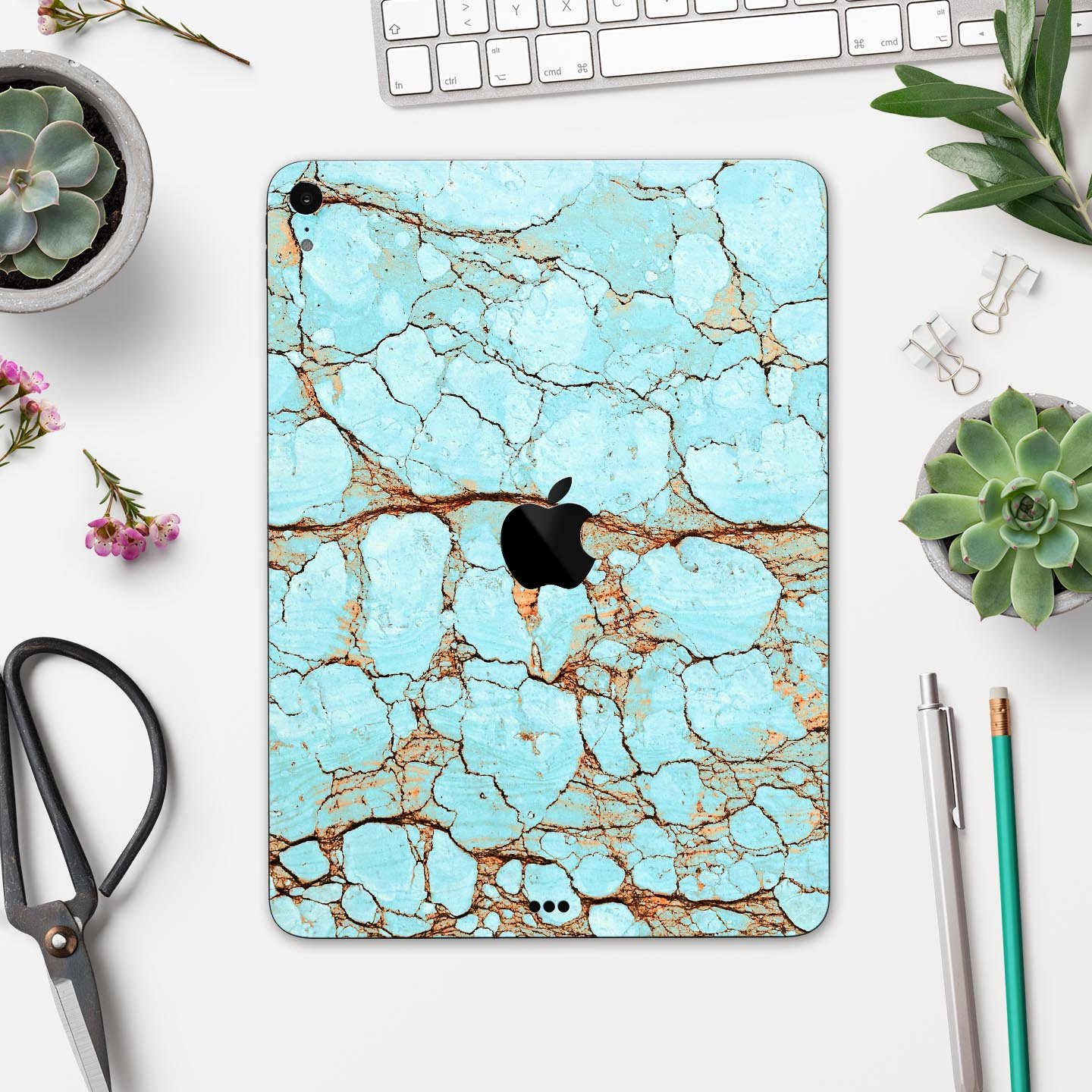 Cracked Teal Stone skin decal for Apple iPad Pro, showcasing its vibrant design and premium finish.