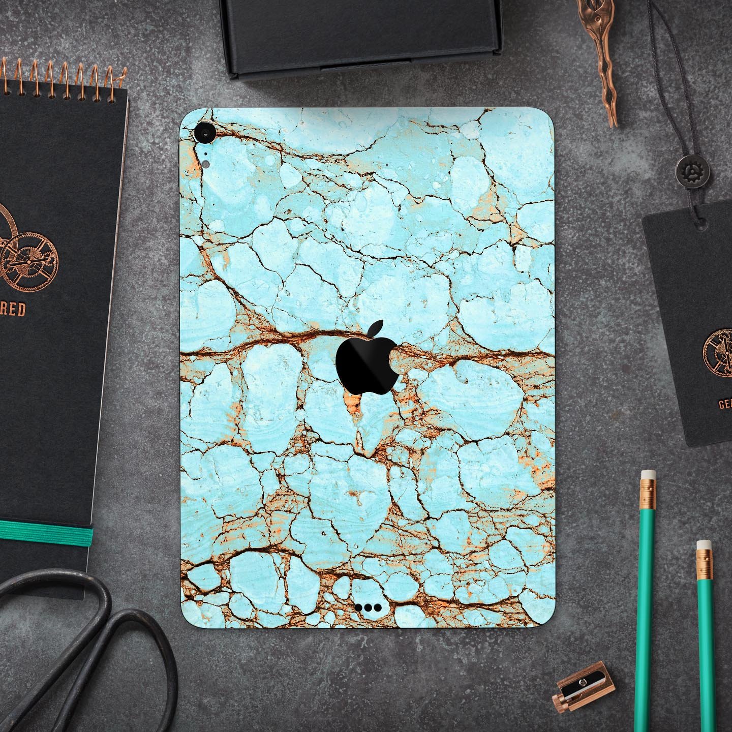 Cracked Teal Stone skin decal for Apple iPad Pro, showcasing its vibrant design and premium finish.