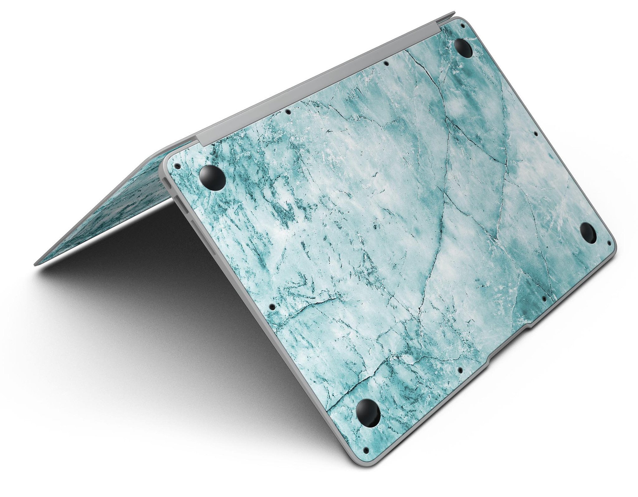 Cracked turquoise marble skin applied on a MacBook Air, showcasing its stylish design and sleek finish.