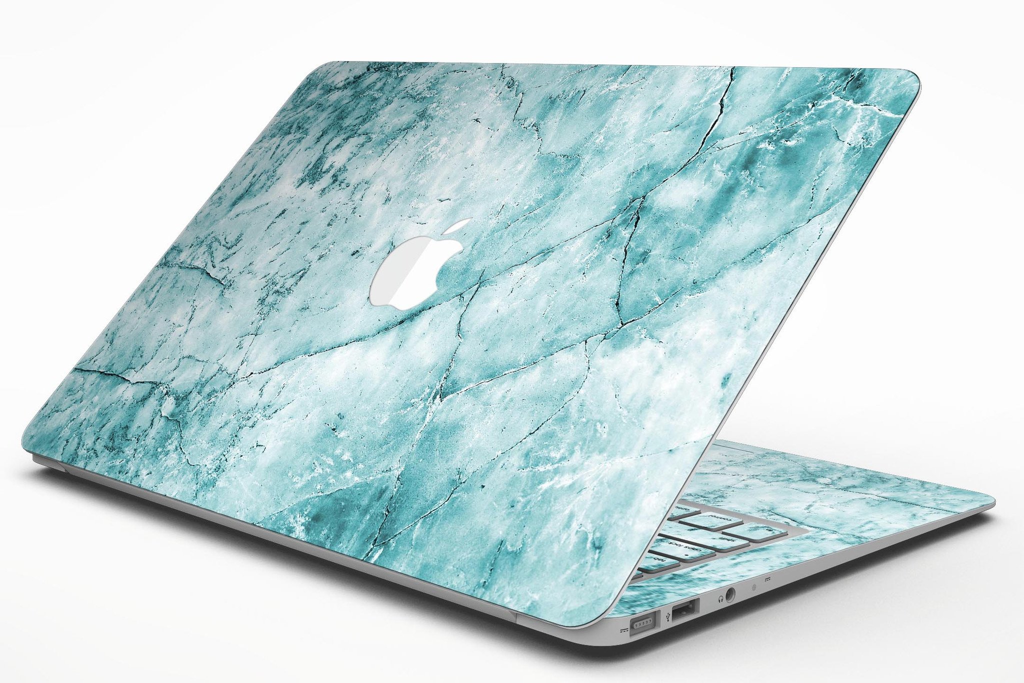 Cracked turquoise marble skin applied on a MacBook Air, showcasing its stylish design and sleek finish.