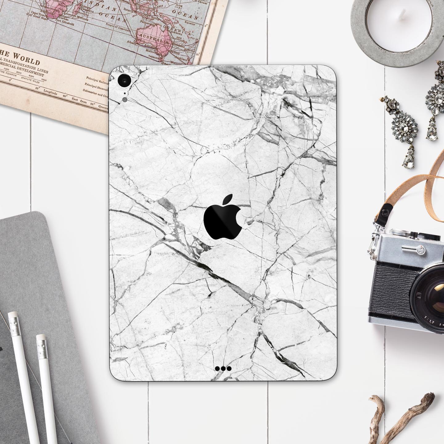 Cracked White Marble Slate skin decal for Apple iPad, showcasing a stylish marble design with a smooth finish.