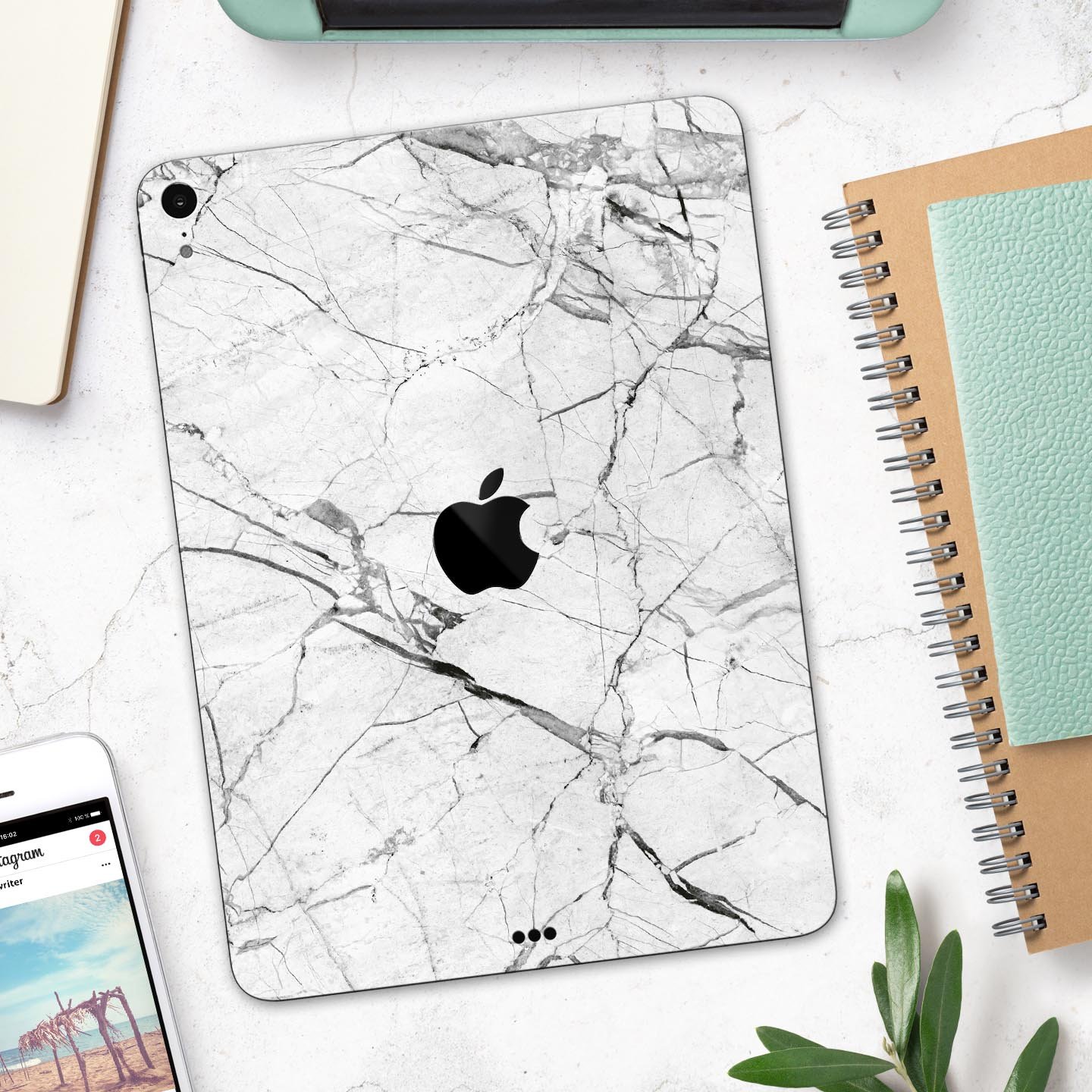 Cracked White Marble Slate skin decal for Apple iPad, showcasing a stylish marble design with a smooth finish.