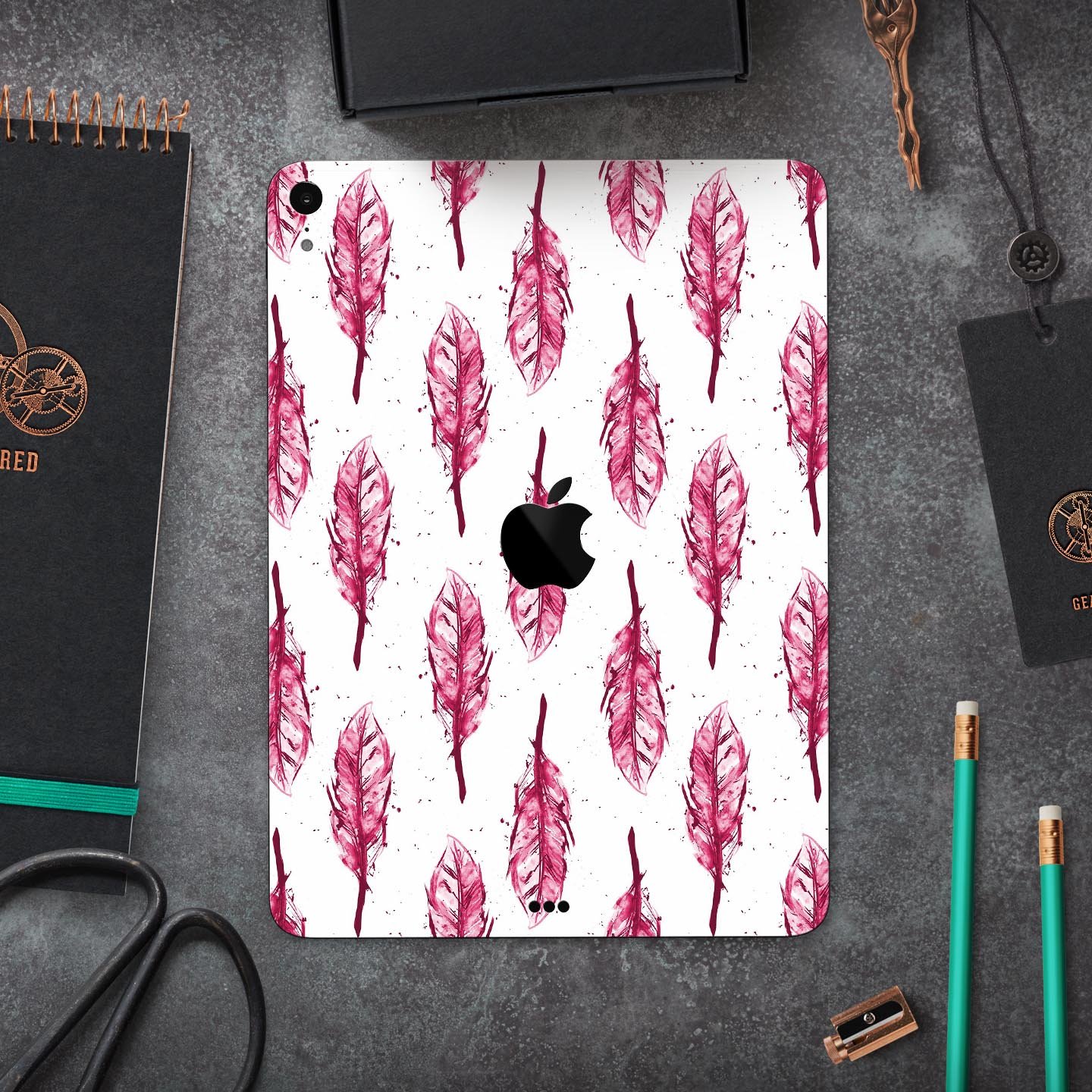 Crimson Feather Pattern skin decal for Apple iPad Pro, showcasing vibrant colors and intricate feather design.