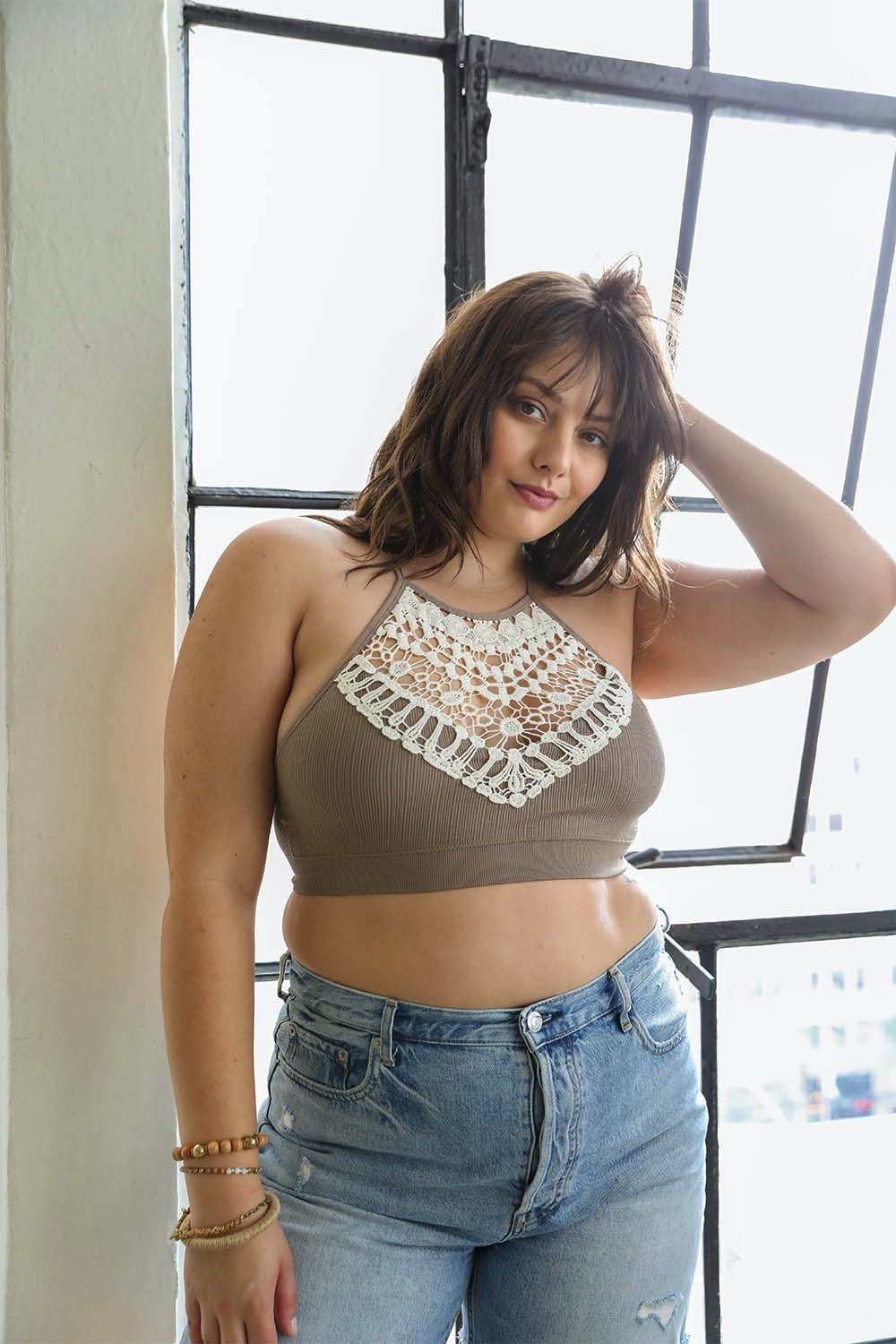 A stylish Crochet Lace Bralette Plus featuring delicate lace trimming and a rounded neckline, designed for comfort and support.