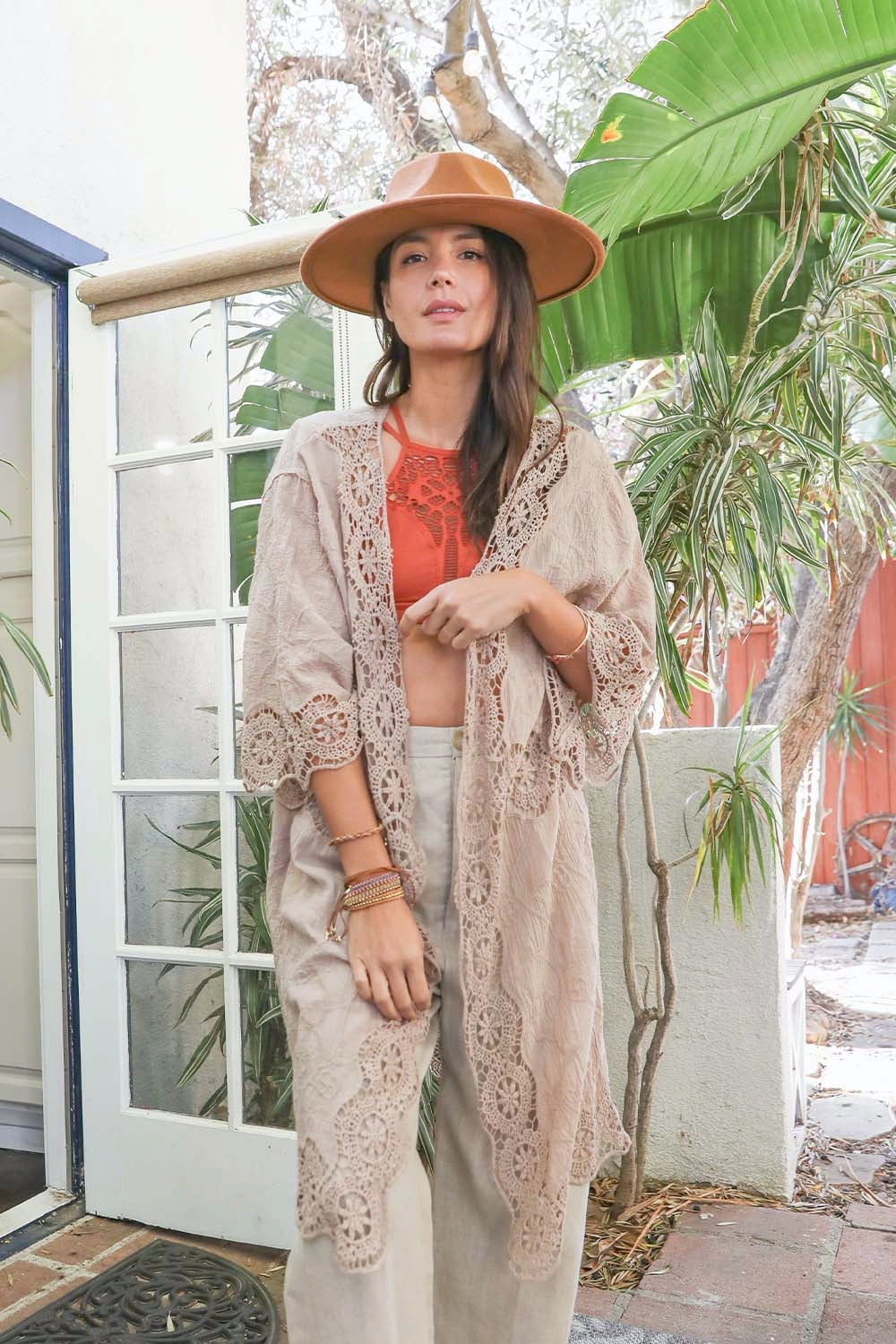 A lightweight crochet open patch kimono in a stylish design, perfect for layering over outfits.