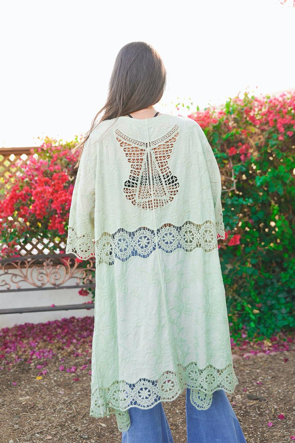 A lightweight crochet open patch kimono in a stylish design, perfect for layering over outfits.