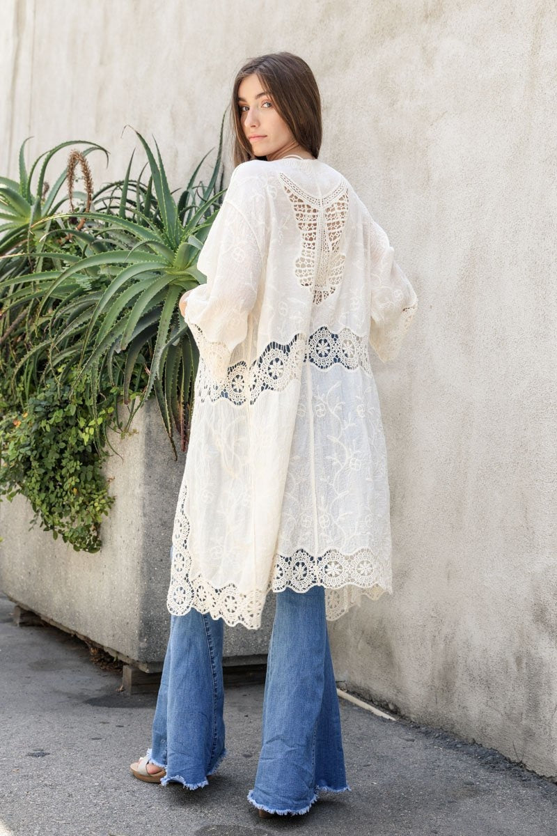 A lightweight crochet open patch kimono in a stylish design, perfect for layering over outfits.