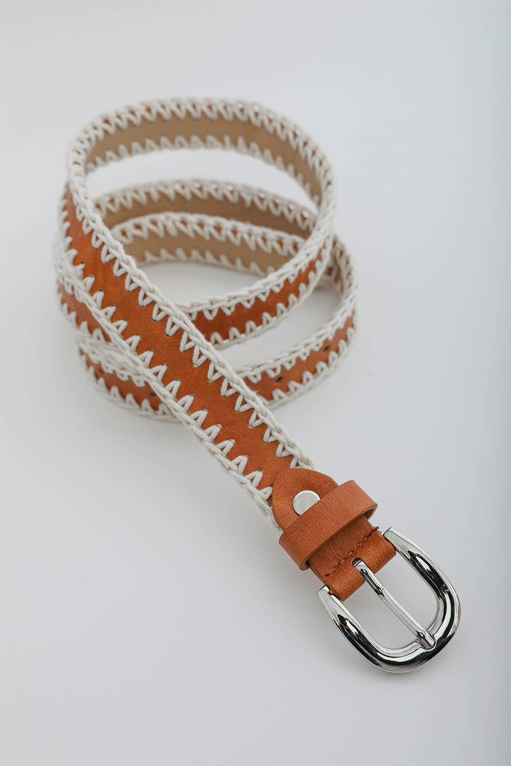 A stylish Crochet Vegan Leather Belt featuring unique crochet detailing, adjustable fit, and made from eco-friendly vegan leather.