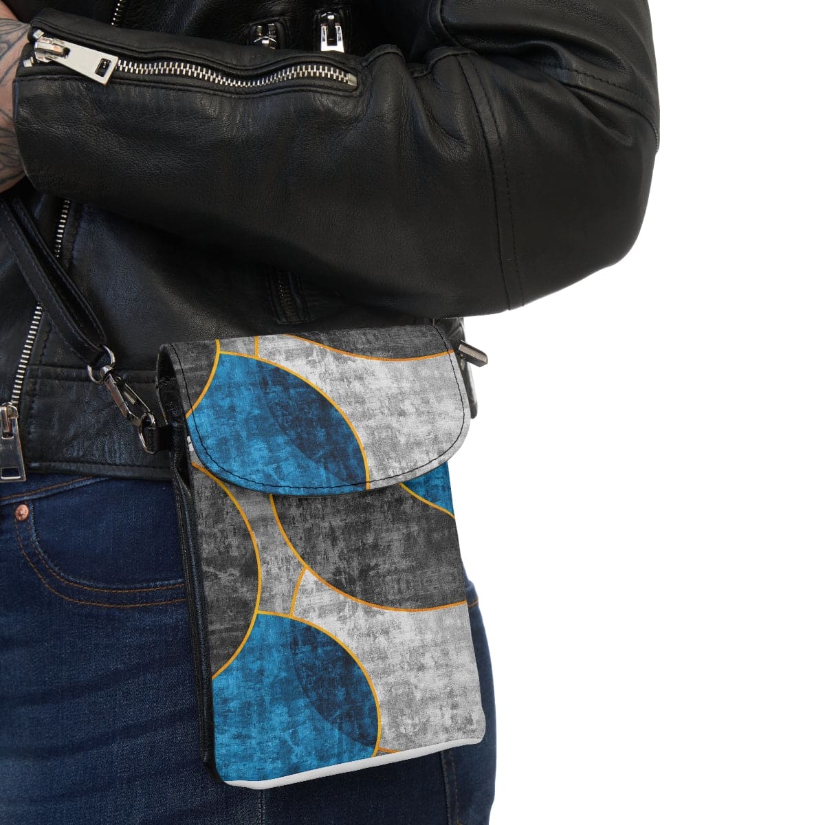 Crossbody cell phone purse featuring a black, blue, and grey circular geometric pattern, with adjustable strap and compartments for phone and cards.