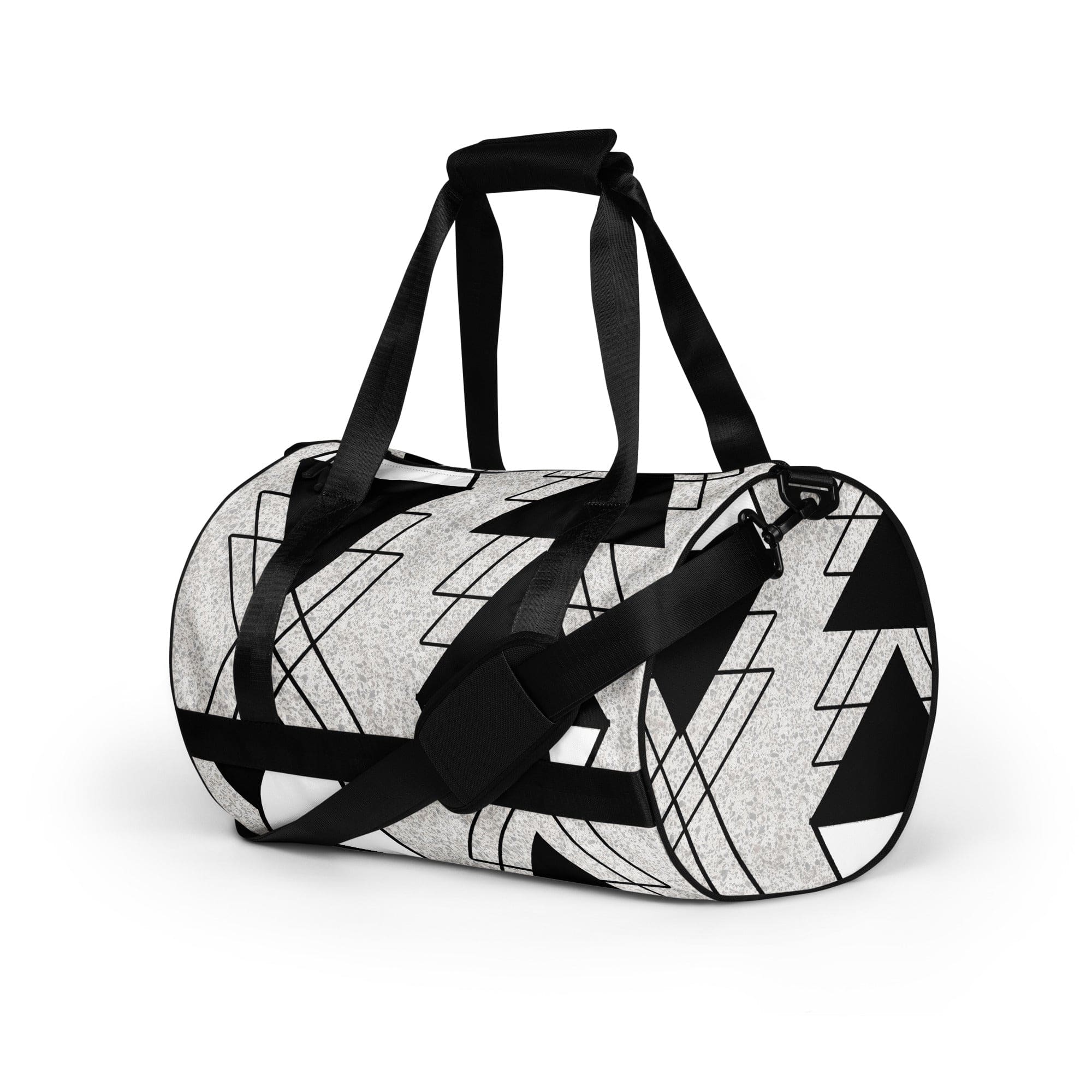 Crossbody Water-resistant Travel Bag in Black and White Ash Grey with triangular colorblock design, showcasing its durable fabric and multiple pockets.