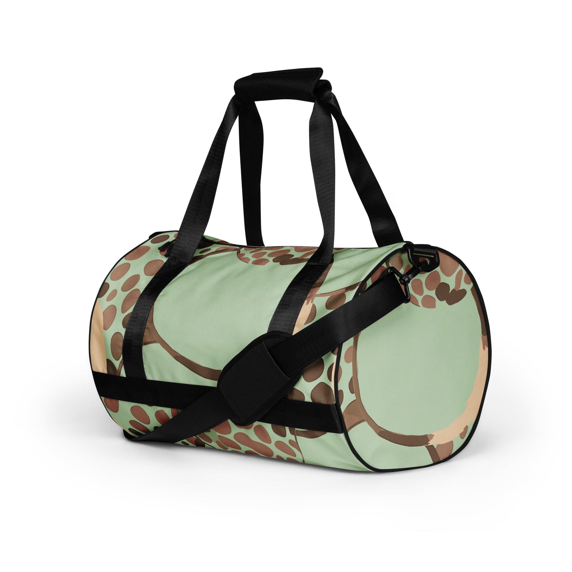 Crossbody water-resistant travel bag in mint green with brown spots, featuring dual padded handles and multiple pockets.