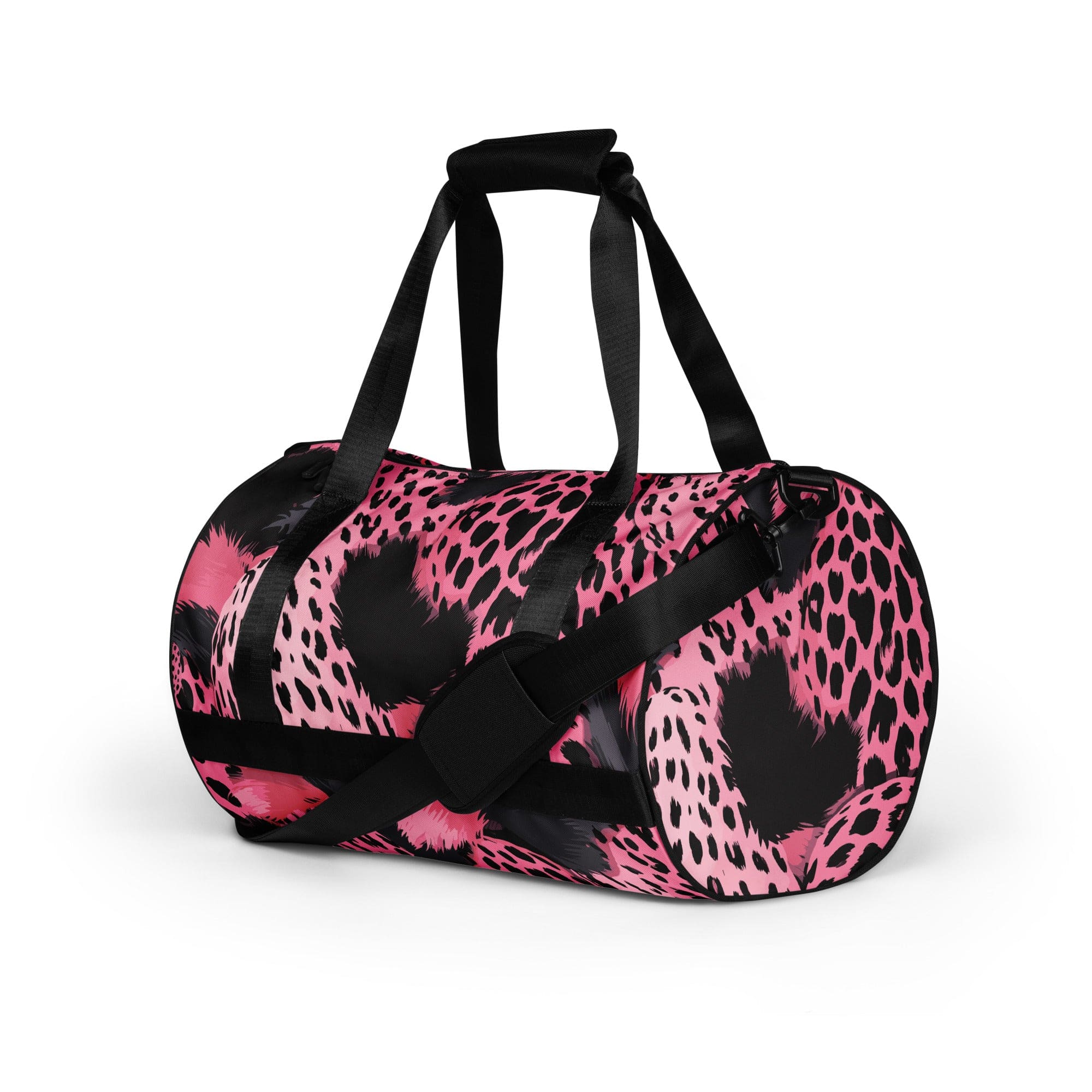 Crossbody water-resistant travel bag in pink and black spotted design, featuring dual padded handles and multiple pockets.