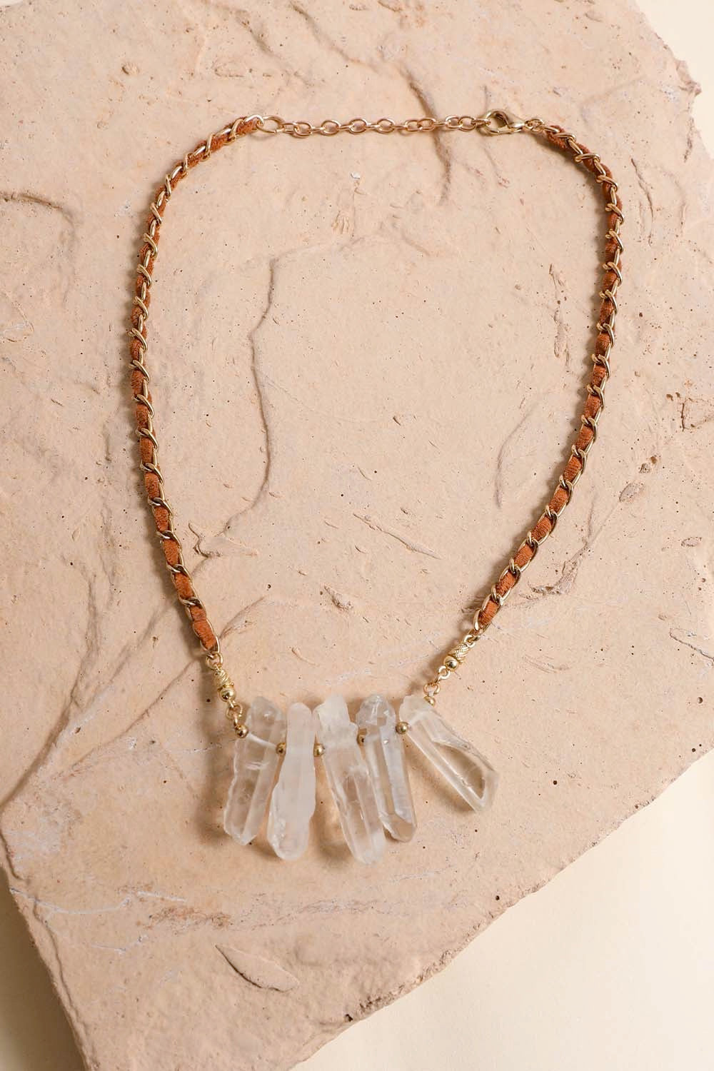 A stylish Crystal Drop Suede Necklace featuring delicate crystals on a soft suede cord, perfect for casual or elegant outfits.