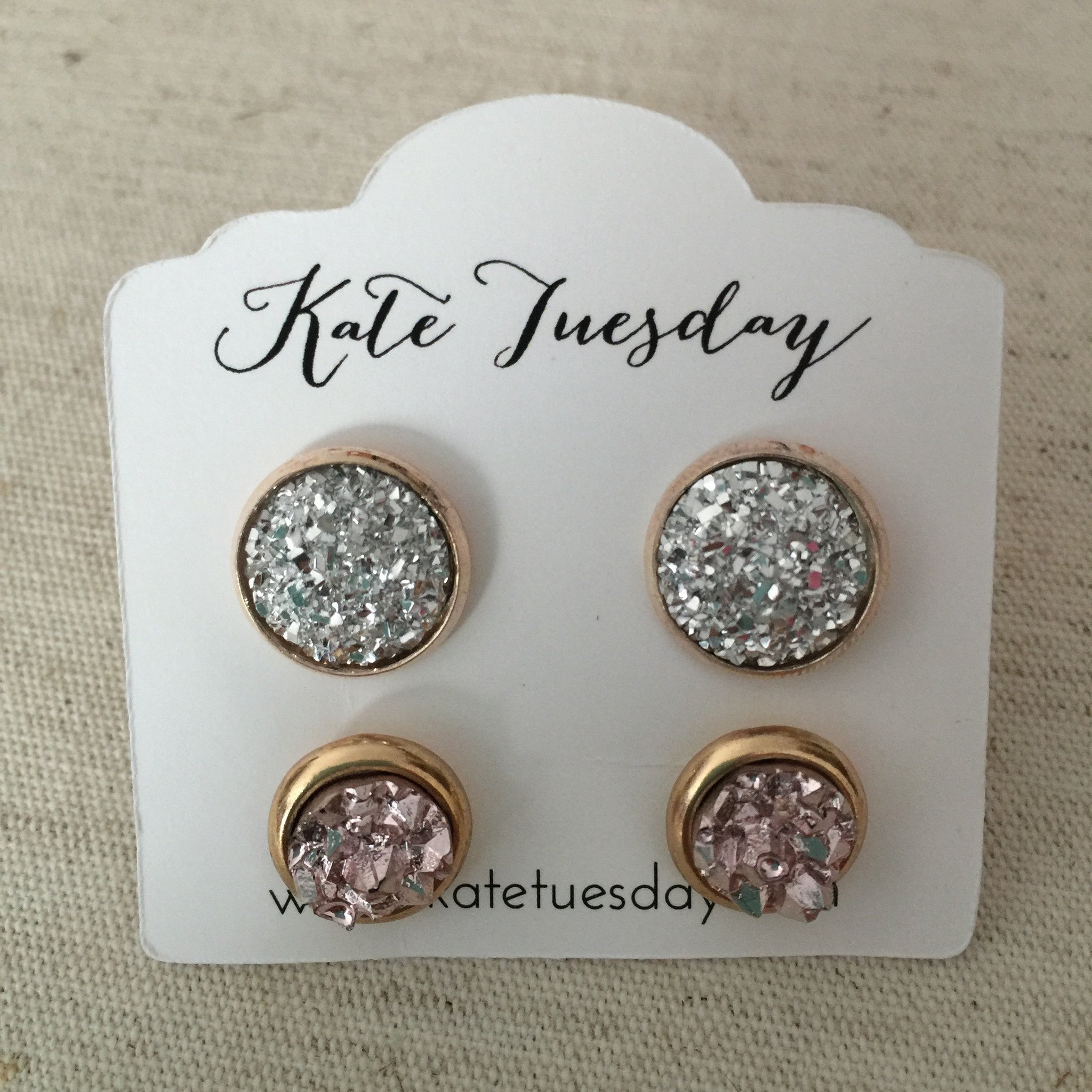 A beautiful set of Crystal Druzy Earrings featuring 8mm rose and 12mm silver stones, handcrafted in Florida, showcasing their shimmering texture.