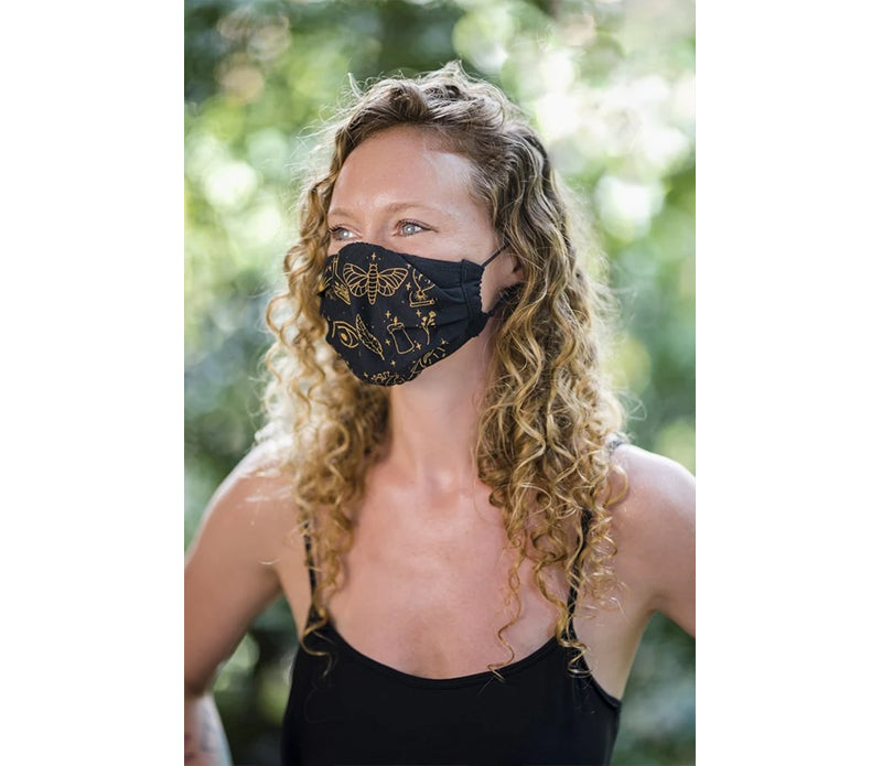 A stylish Crystal Face Mask handmade in Bali, featuring Selenite-infused ink with magical symbols, available in multiple colors.