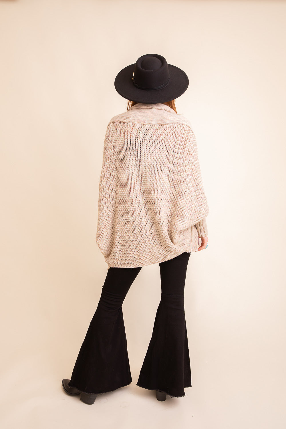 Cuddly Bat Sleeve Knit Cardigan in a cozy oversized fit, showcasing its stylish bat sleeves and soft texture.