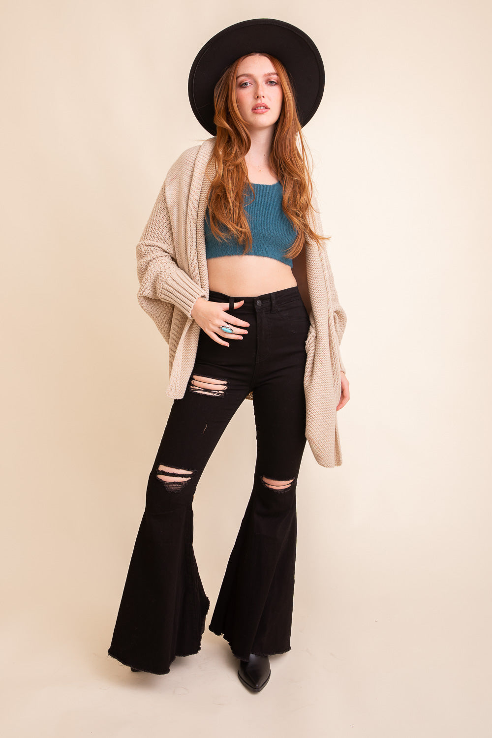 Cuddly Bat Sleeve Knit Cardigan in a cozy oversized fit, showcasing its stylish bat sleeves and soft texture.