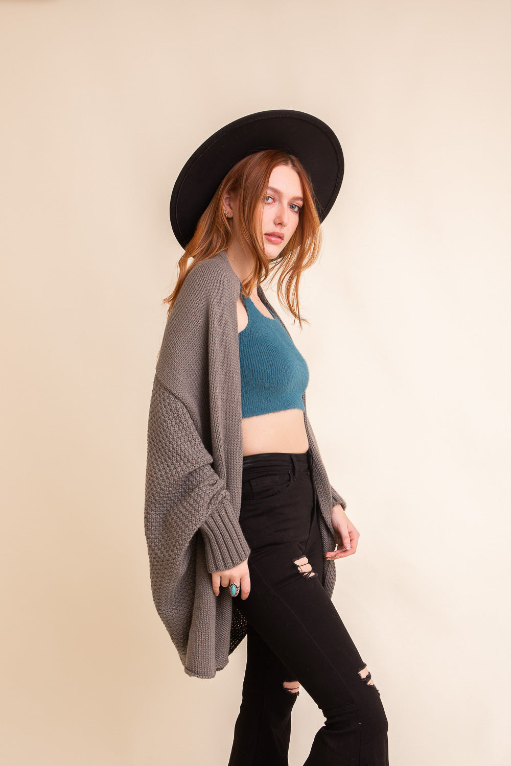 Cuddly Bat Sleeve Knit Cardigan in a cozy oversized fit, showcasing its stylish bat sleeves and soft texture.