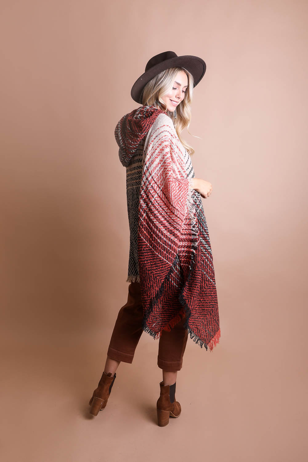 A cozy Cuddly Herringbone Hooded Poncho featuring a stylish herringbone pattern and a cute hood, perfect for chilly weather.