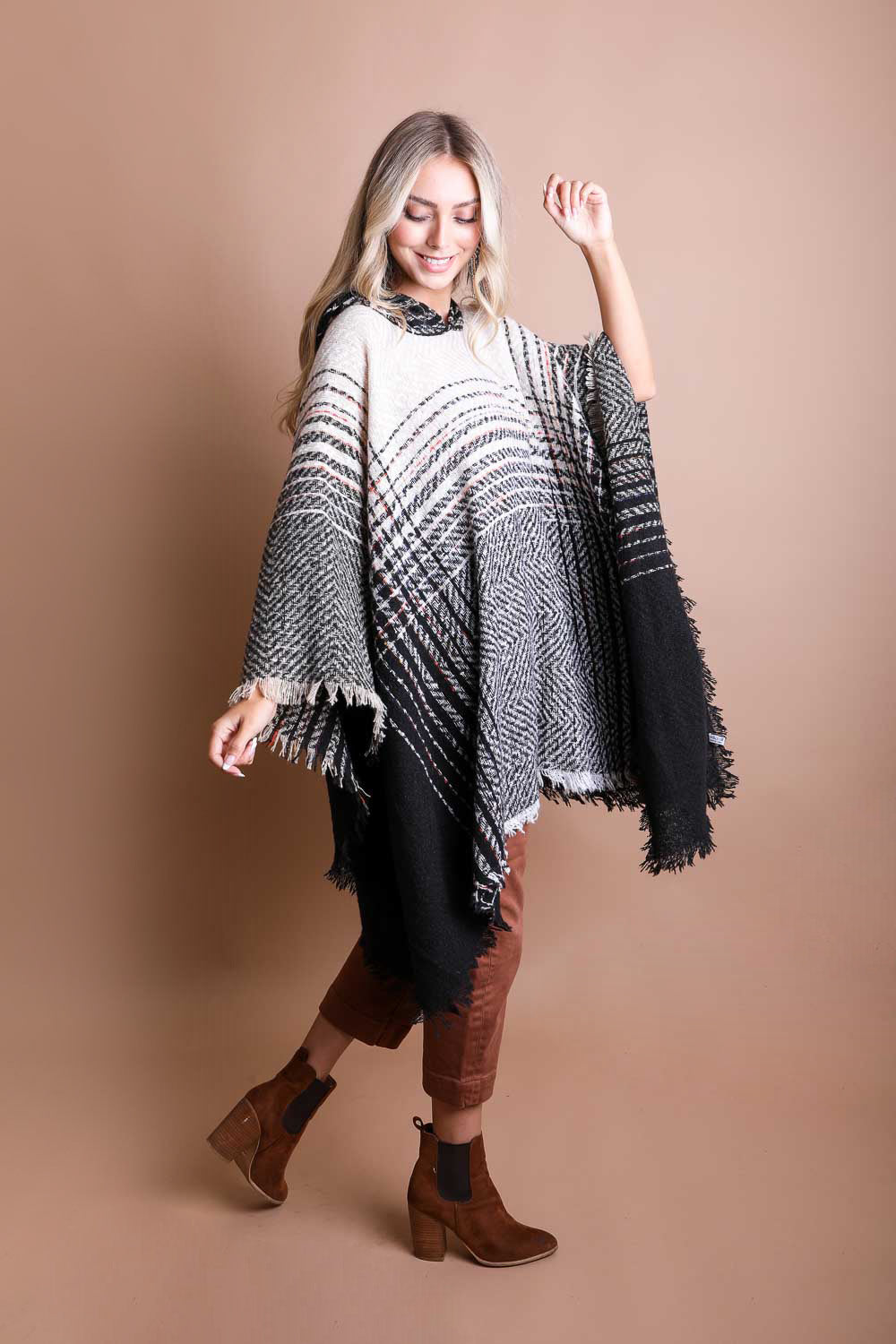 A cozy Cuddly Herringbone Hooded Poncho featuring a stylish herringbone pattern and a cute hood, perfect for chilly weather.