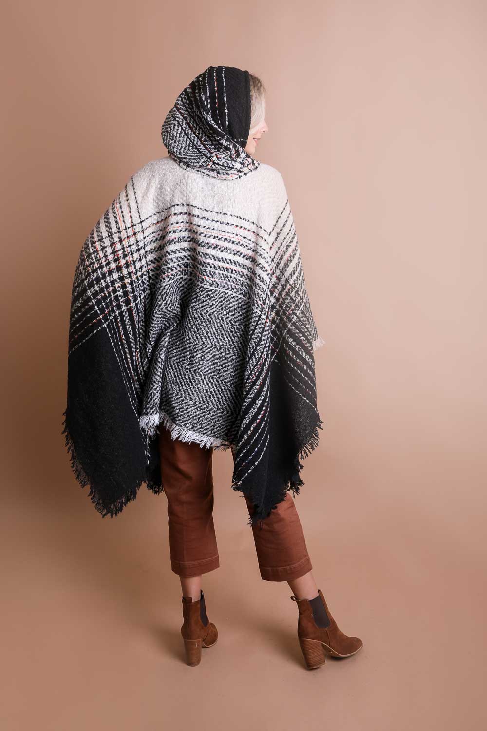 A cozy Cuddly Herringbone Hooded Poncho featuring a stylish herringbone pattern and a cute hood, perfect for chilly weather.