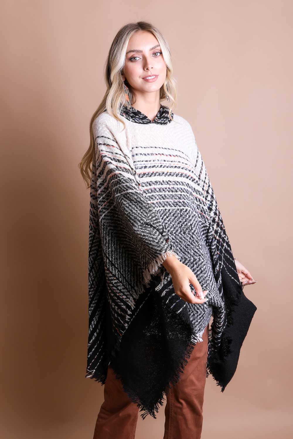 A cozy Cuddly Herringbone Hooded Poncho featuring a stylish herringbone pattern and a cute hood, perfect for chilly weather.