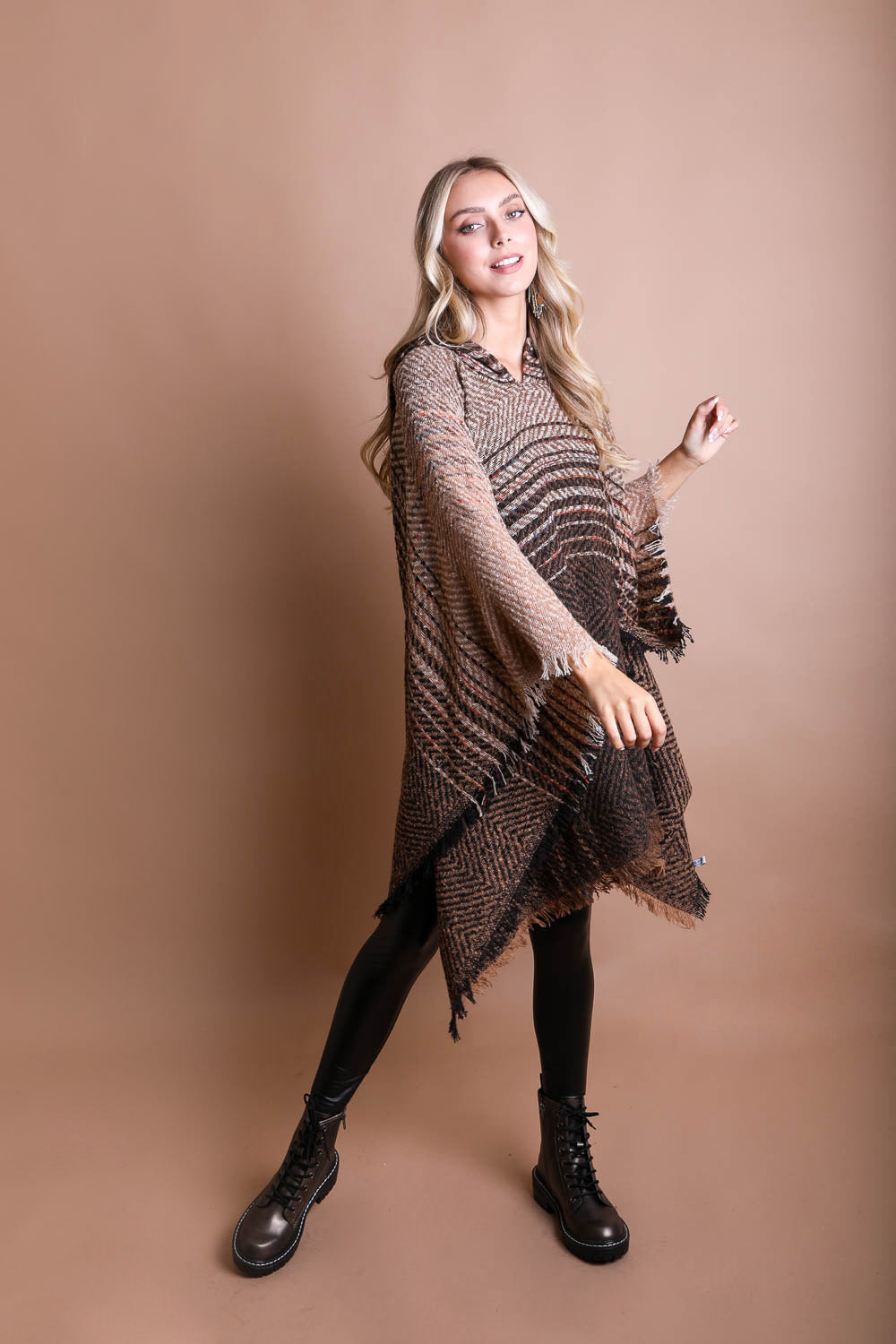 A cozy Cuddly Herringbone Hooded Poncho featuring a stylish herringbone pattern and a cute hood, perfect for chilly weather.