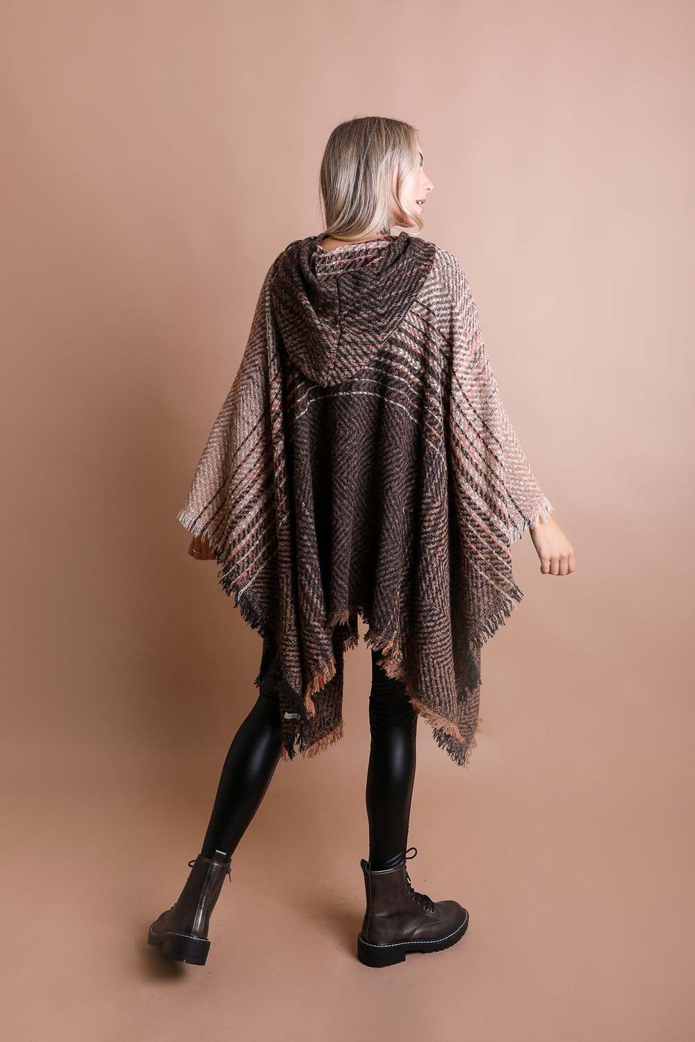 A cozy Cuddly Herringbone Hooded Poncho featuring a stylish herringbone pattern and a cute hood, perfect for chilly weather.