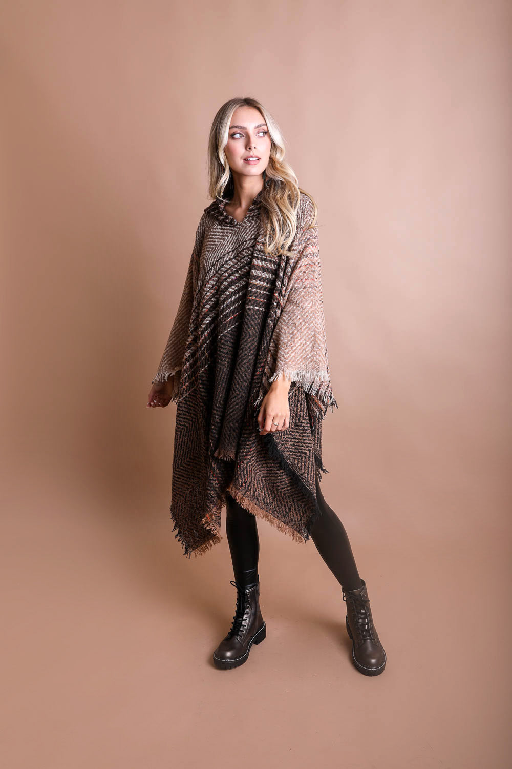 A cozy Cuddly Herringbone Hooded Poncho featuring a stylish herringbone pattern and a cute hood, perfect for chilly weather.