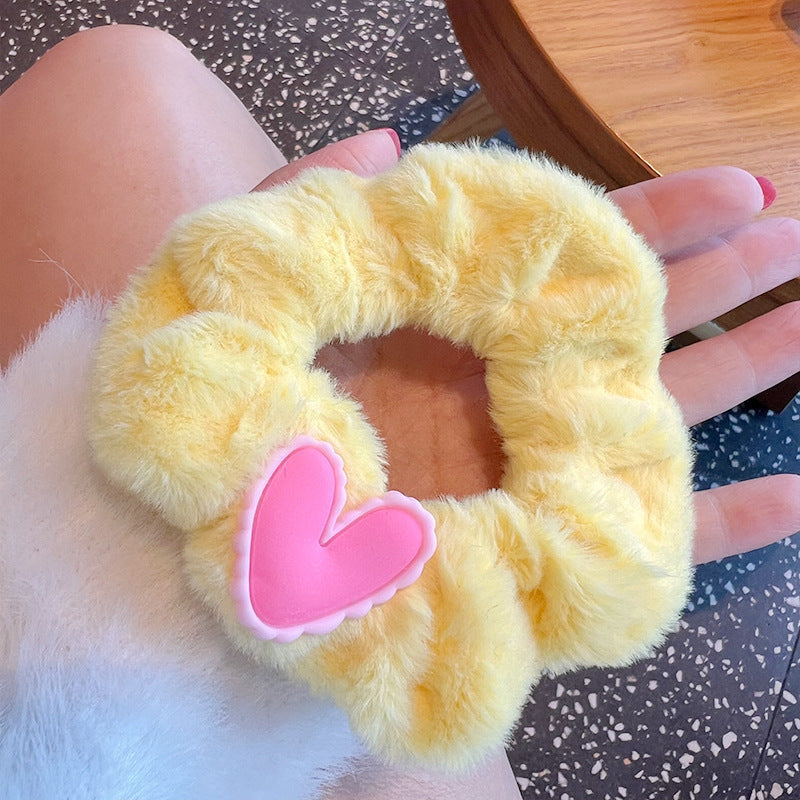 Cute Plush Hair Tie featuring soft plush material in a charming design, perfect for stylish hairstyles.