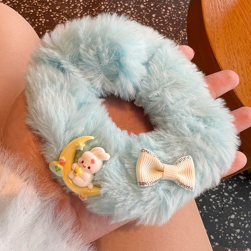 A set of four cute and soft scrunchies featuring moon-shaped rabbits and bears, perfect for adding charm to hairstyles.