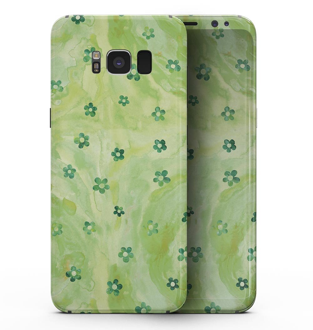 Samsung Galaxy S8 with cute watercolor flowers skin, showcasing vibrant floral design on a green background.