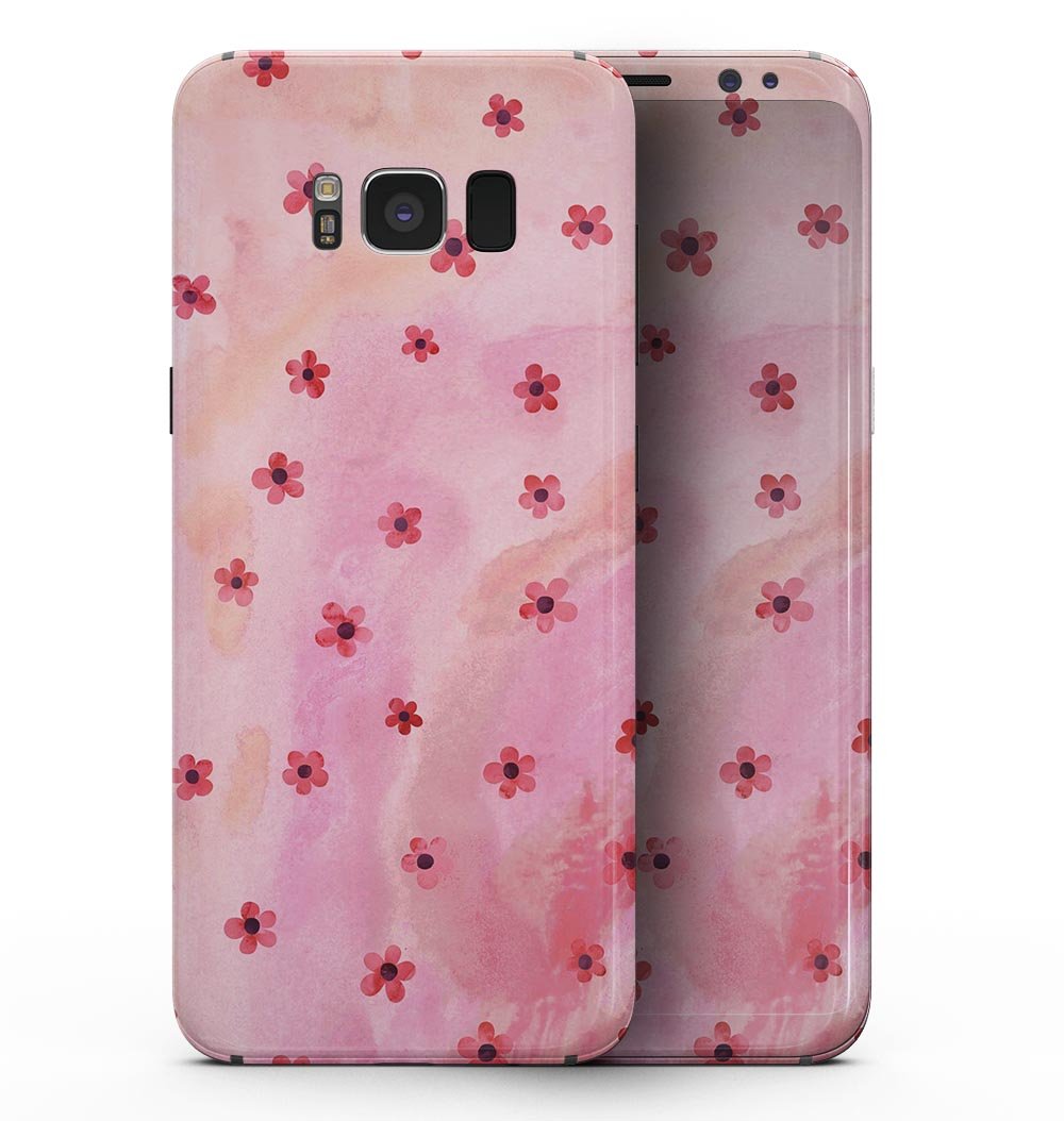 Samsung Galaxy S8 with cute watercolor flowers skin over a pink background, showcasing vibrant colors and stylish design.