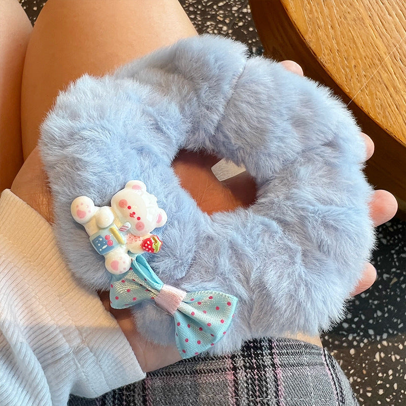 Cute white bear plush hair tie with a charming bow, perfect for adding style to any hairstyle.