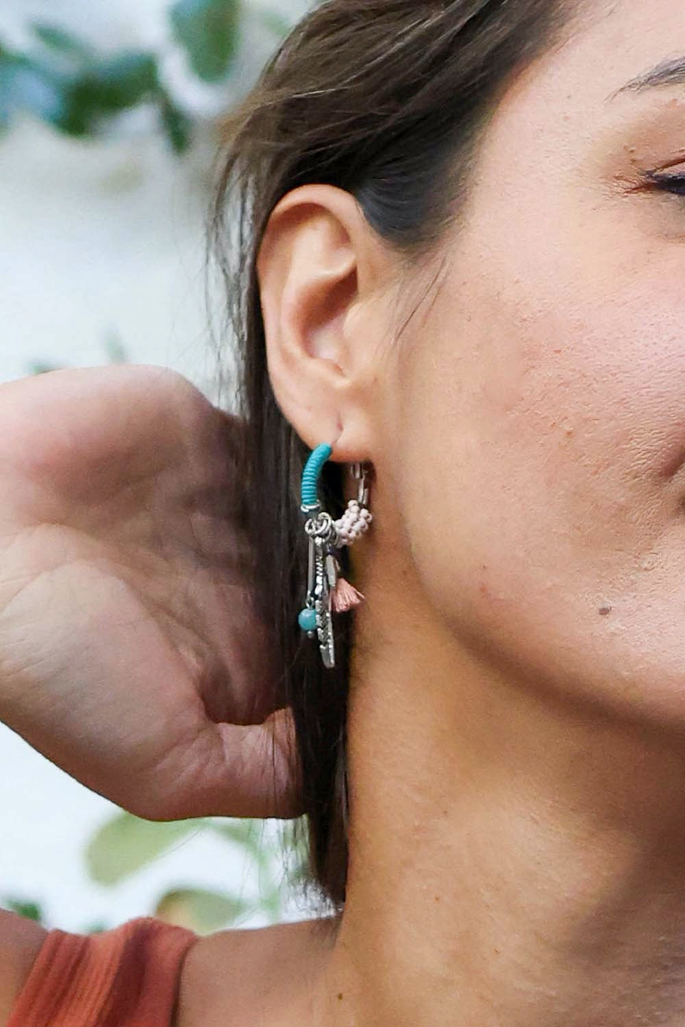 A pair of delicate Dainty Feather Hoop Earrings featuring a lightweight design, perfect for any occasion.