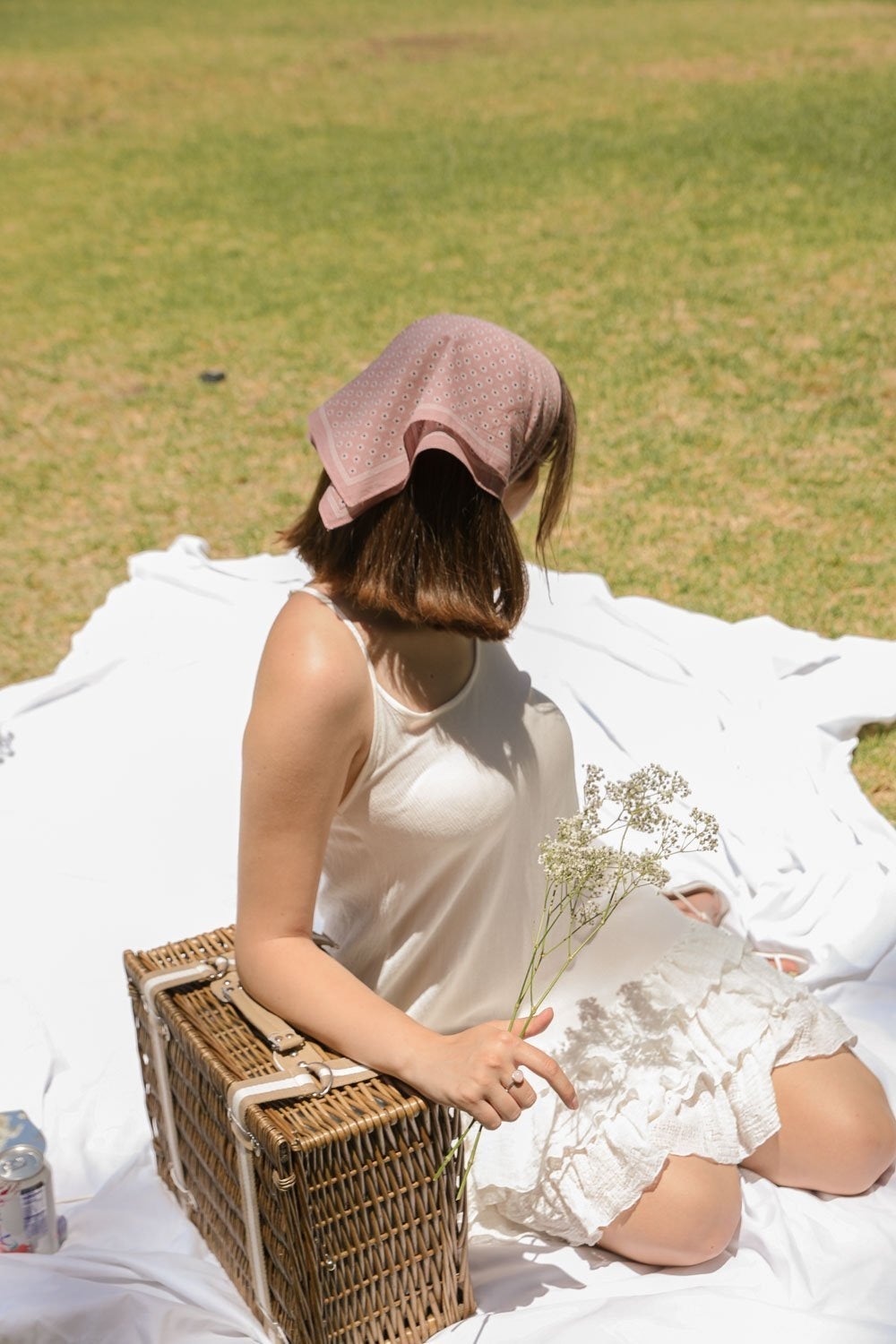 Daisy Flower Field Bandana featuring a vibrant floral print, styled as a hair wrap and neck scarf.