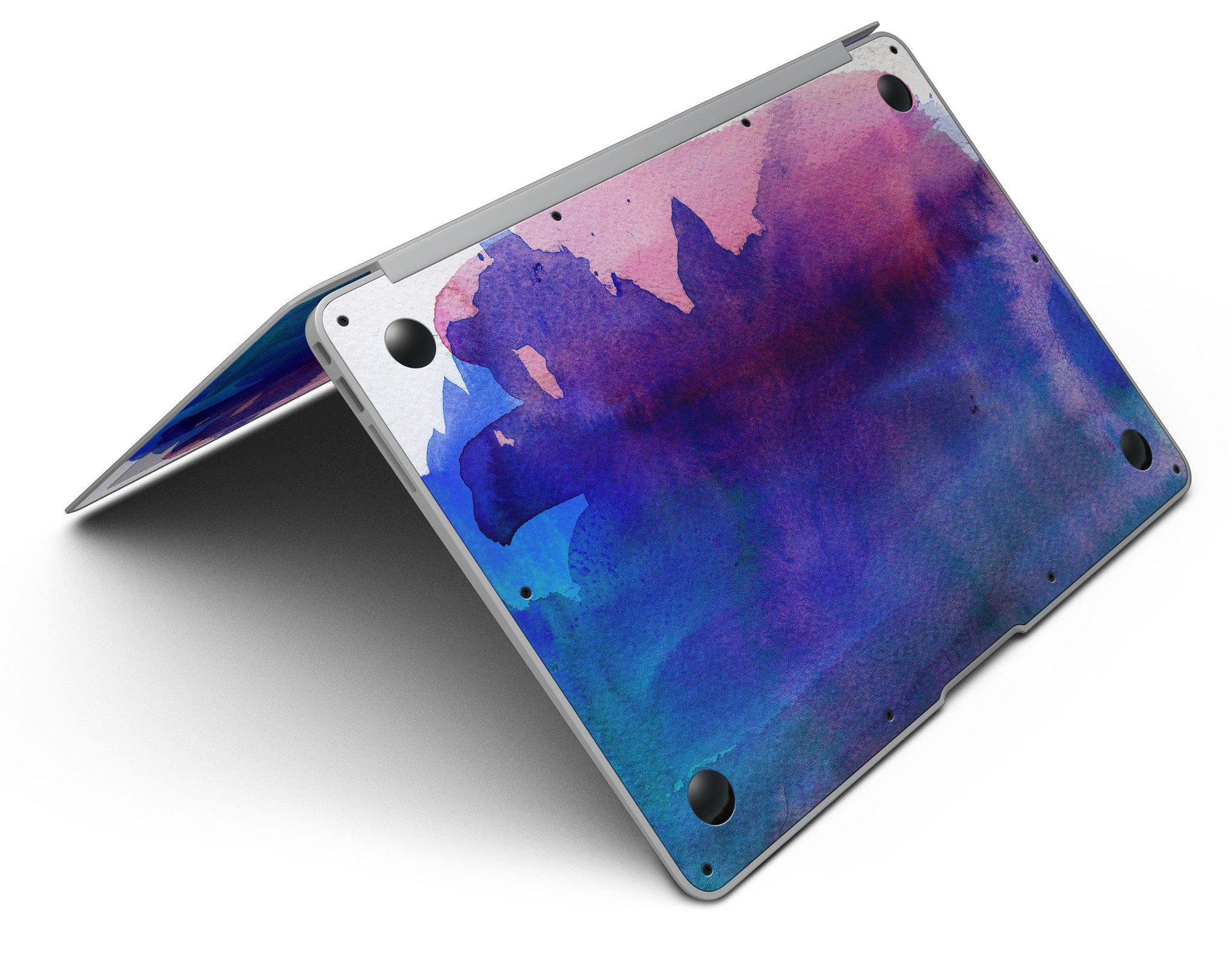 Dark Absorbed Watercolor Texture skin applied on a MacBook Air, showcasing vibrant colors and sleek design.