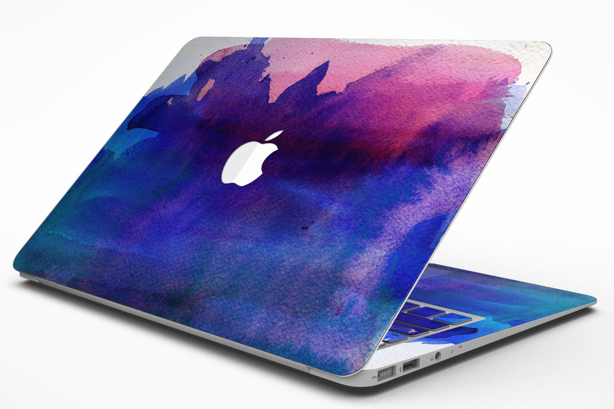 Dark Absorbed Watercolor Texture skin applied on a MacBook Air, showcasing vibrant colors and sleek design.