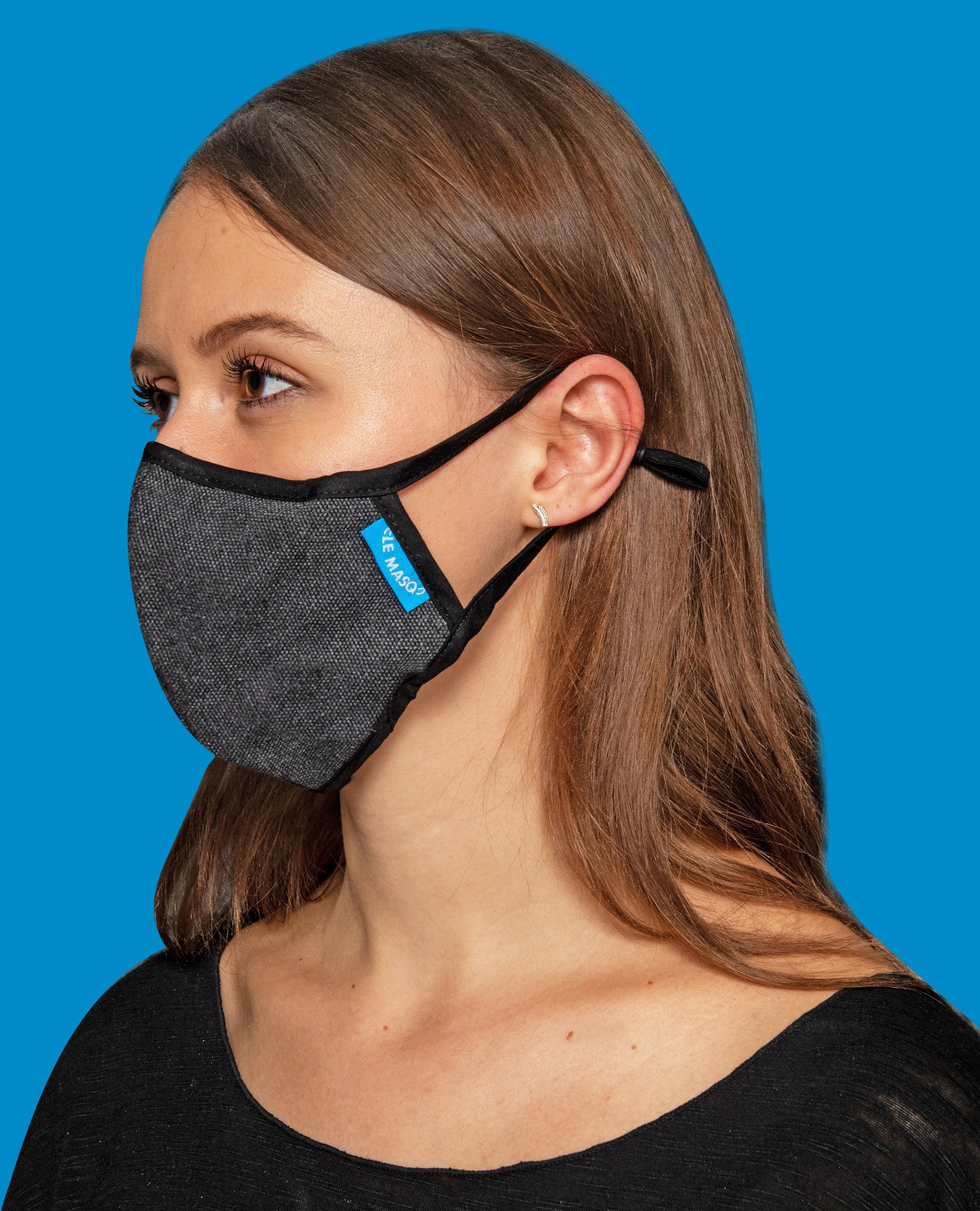 Dark Blue Canvas Mask featuring a breathable design with a removable inner layer and adjustable ear toggles for a comfortable fit.